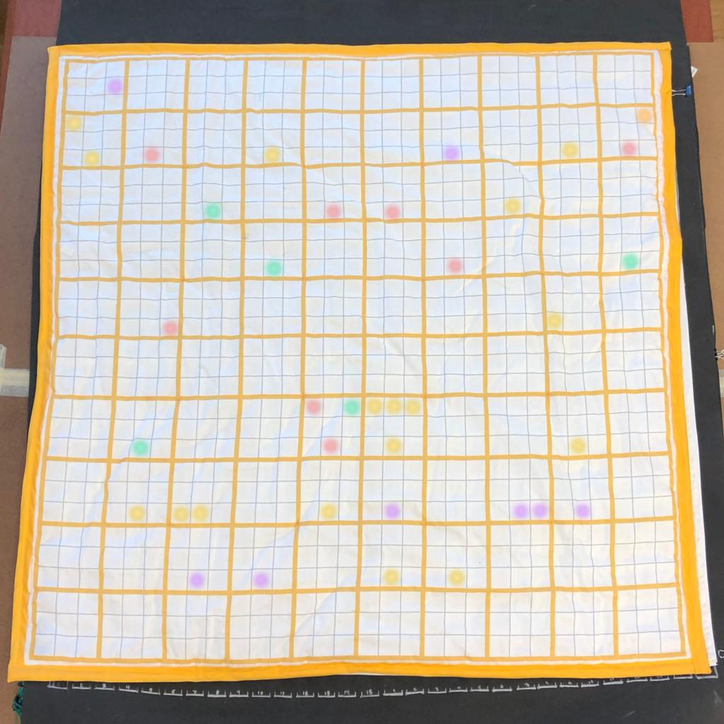 The Floor Chart A photo of the completed Floor Chart. LEDs in a variety of colors illuminate a smattering of squares across the chart.