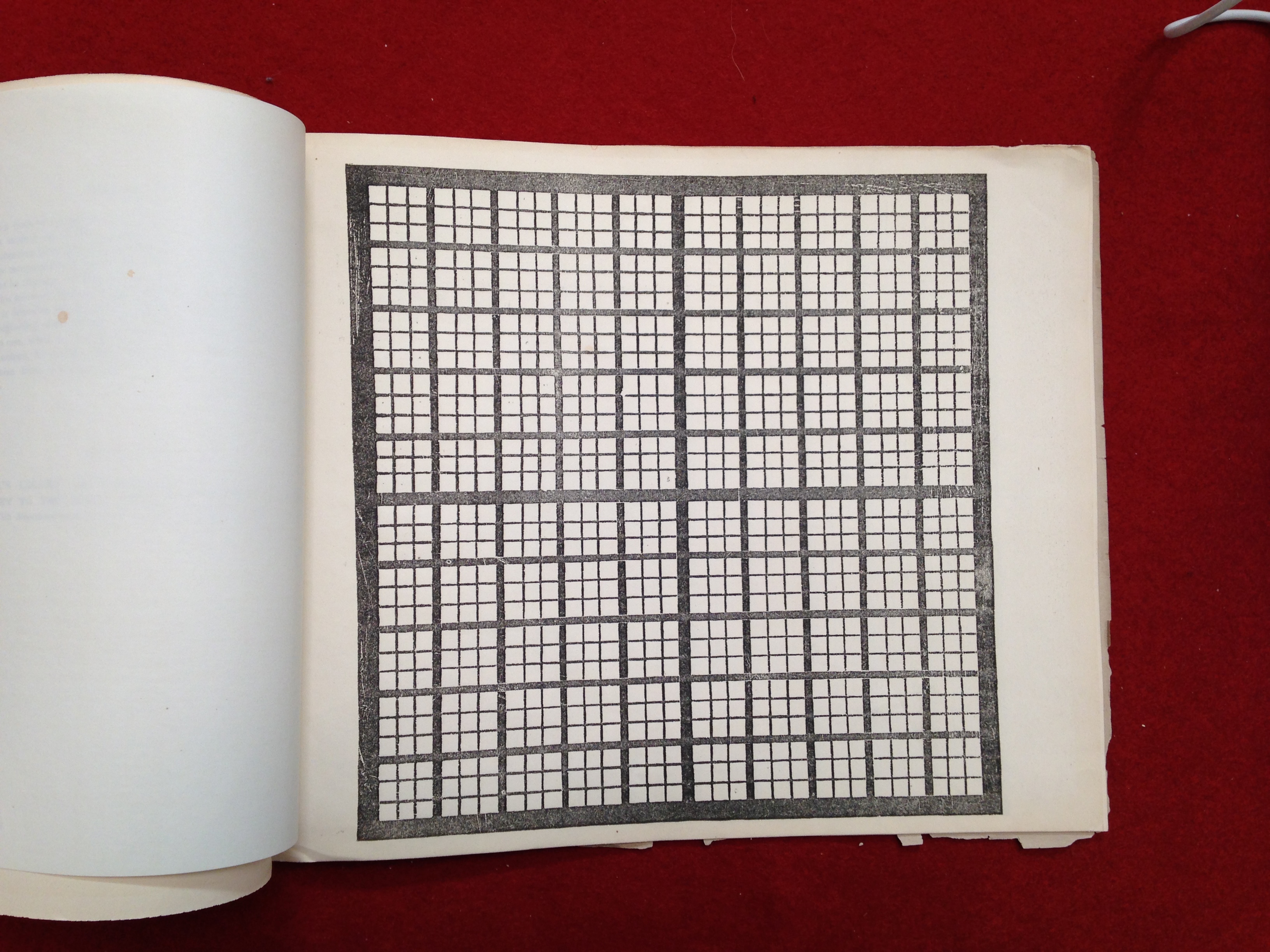 n/a A page of a blank chart in Peabody’s workbook, set against a red backdrop.